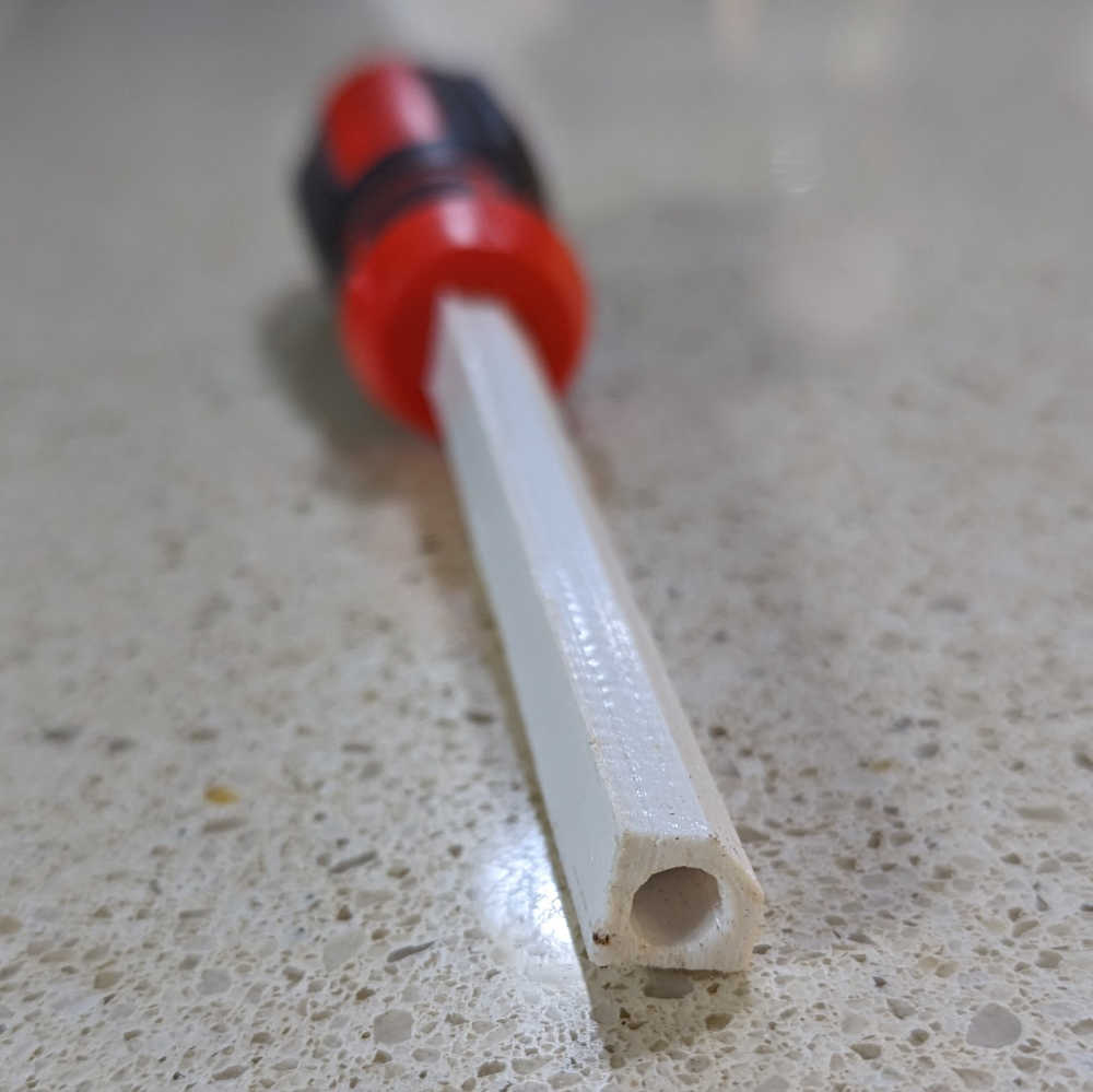 A screwdriver with a 3D-printed accessory installed
